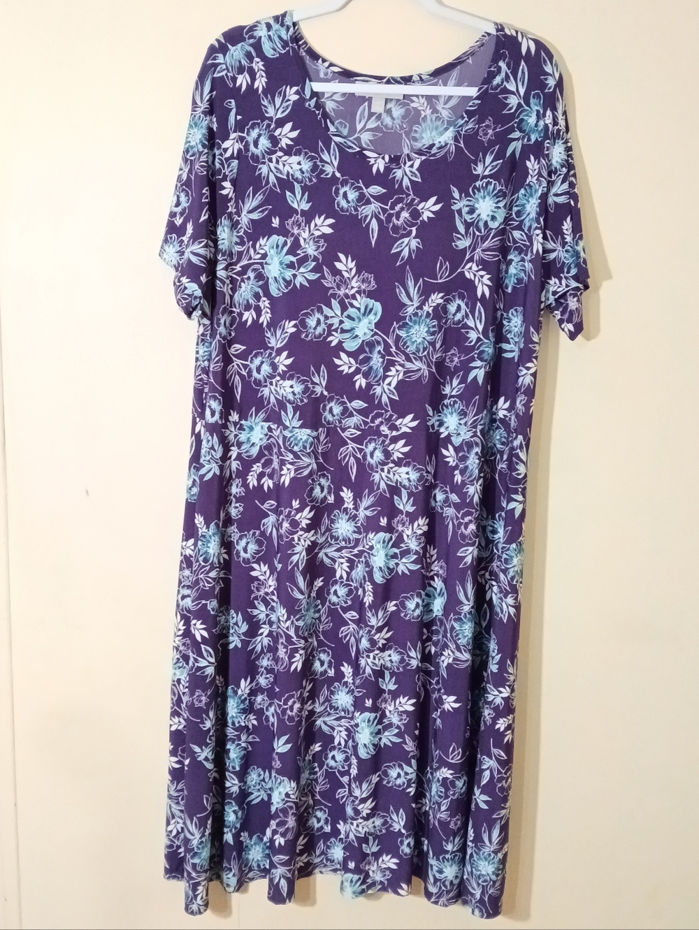 Woman within purple floral stretch dress